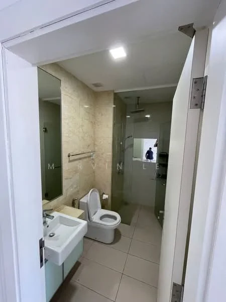 Bathroom features: white ceramic toilet, single-sink vanity with light blue cabinet, chrome basin mixer faucet, mirror above sink, glass shower enclosure, rain shower head, tile flooring, light-colored wall tiles, recessed ceiling lights; style: modern.