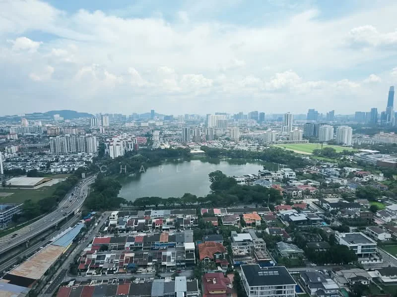 Exterior type: high-rise condominium; features: city skyline view, lake view, surrounding residential areas, highway visible, green park area, urban landscape, mixed-use development, varied building heights; style: modern.