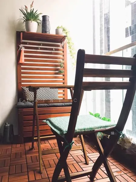 Balcony features: wooden folding chairs, green cushion on chair, wooden slatted wall shelf, decorative potted plants, black decorative vase, striped cushion, wooden flooring, greenery visible outside; style: modern; view: city.