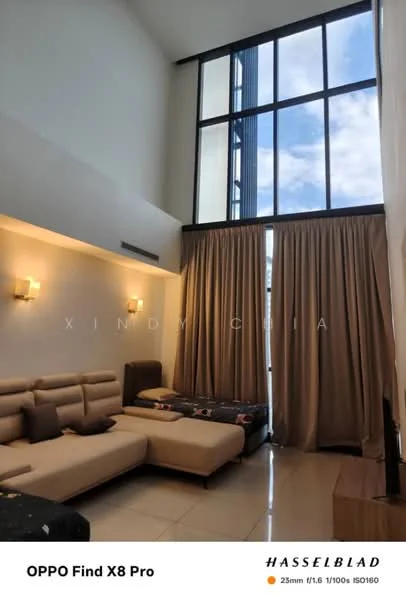 Living features: high ceiling, large floor-to-ceiling windows, cream painted walls, light-colored tiled flooring, sofa with beige upholstery, decorative wall sconces, curtains in light brown, area rug, coffee table, wall-mounted TV, decorative cushions; style: modern.