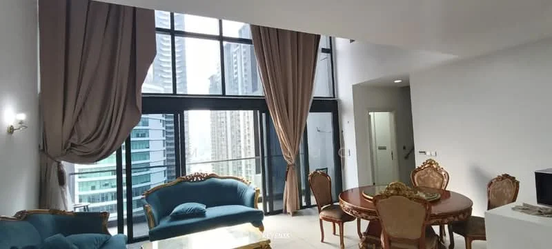 Living features: floor-to-ceiling windows, curtains in beige, blue fabric sofa, round dining table, upholstered dining chairs in gold, decorative wall sconce, light-colored flooring, open layout, city view from windows, wall-mounted TV, decorative mirror; style: modern; view: city.