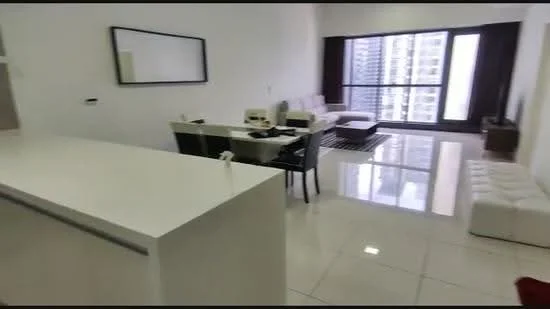 Living features: white walls, glossy tile flooring, floor-to-ceiling windows, blackout curtains, sofa in light color, coffee table, TV console, area rug with geometric pattern, dining table with black chairs, white cabinetry, decorative mirror; style: modern; view: city. Room features: white countertop, open layout, recessed lighting.