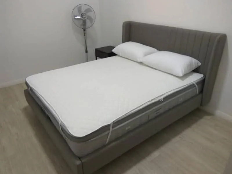 Bedroom features: queen-size bed, upholstered headboard in grey, white bedding, nightstand, table lamp, floor fan, light wood flooring, white painted walls; style: modern.