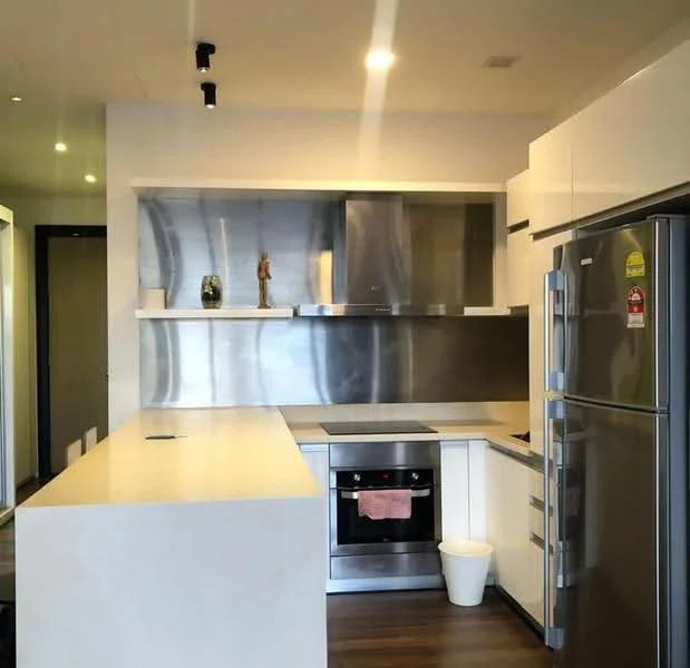 Kitchen features: stainless-steel refrigerator, stainless-steel oven, stainless-steel range hood, white cabinetry, white countertop, open shelving, wood flooring, track lighting, single-bowl sink, chrome faucet; style: modern.