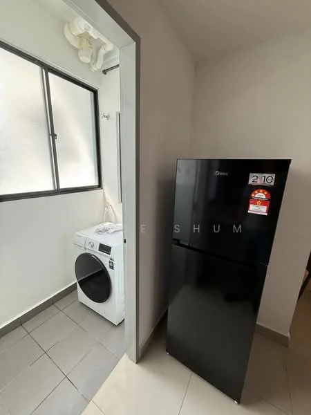 Laundry features: black fridge, white front-load washing machine, grey tile flooring, window with black frame, white walls, ceiling-mounted piping, space for additional storage.