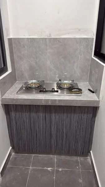 Kitchen features: grey marble countertop, grey tile backsplash, stainless-steel gas hob with two burners, wooden cabinetry with textured finish, dark grey floor tiles, white painted walls, window for natural light; style: modern.