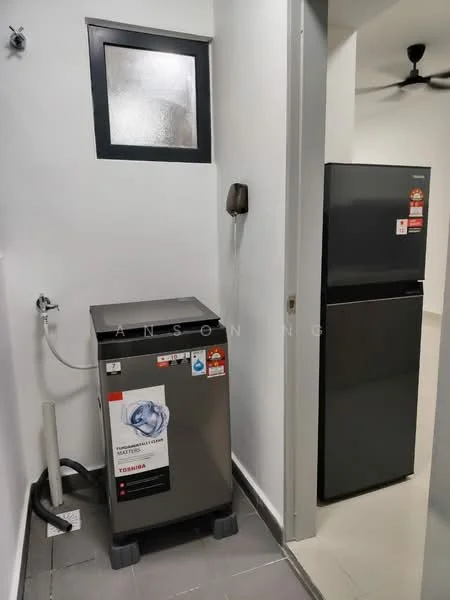 Laundry features: washing machine, grey metallic finish on washing machine, black fridge, wall-mounted phone, small window, white painted walls, grey tile flooring, plumbing connection for washing machine.