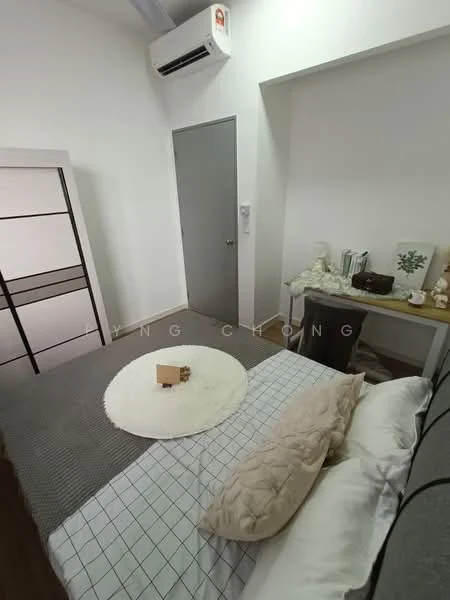 Bedroom features: queen-size bed, upholstered headboard, bedding with geometric pattern, throw pillow, area rug, white painted walls, wooden flooring, 1 wall-mounted split AC, built-in wardrobe with sliding doors, study desk, decorative items on desk, door to hallway; style: modern.