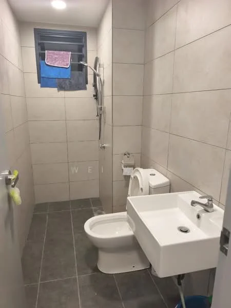 Bathroom features: grey ceramic tile flooring, light grey tiled walls, walk-in shower with glass enclosure, chrome handheld shower, wall-mounted toilet, single-sink vanity with white cabinet, chrome basin mixer faucet, window with metal grille, towel rack, hanging towels; style: modern.