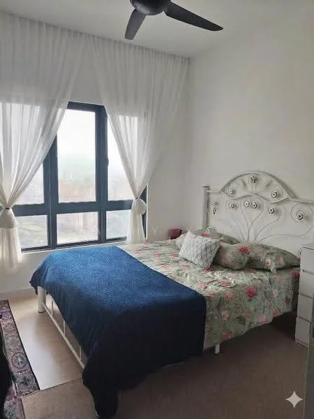 Bedroom features: king-size bed with floral bedding, upholstered headboard, bedside table, decorative throw pillows, floor-to-ceiling windows, sheer curtains, ceiling fan, area rug with geometric pattern, white painted walls, wooden flooring; style: modern; view: city.