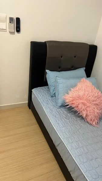 Bedroom features: queen-size bed, upholstered headboard in black, light blue bedding, pink decorative pillow, wooden flooring, wall-mounted air conditioning unit, white painted walls; style: modern.