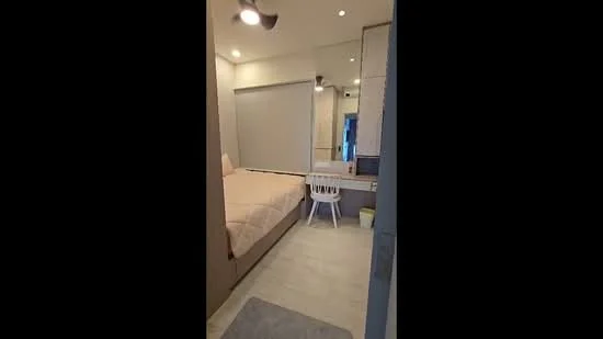 Bedroom features: single bed, upholstered headboard, white bedding, ceiling fan, mirror on wall, white chair, light-colored flooring, roller blinds, built-in wardrobe, decorative wall paneling; style: modern.
