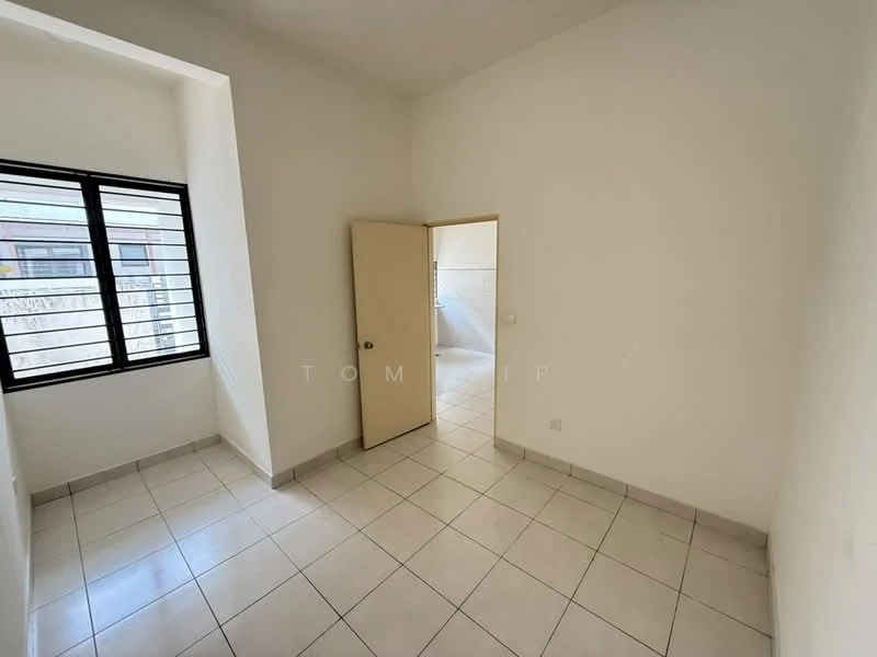 Room features: white painted walls, tile flooring, single door, window with horizontal bars, corner window, neutral color scheme, no visible furniture, natural light from window; style: minimalist.
