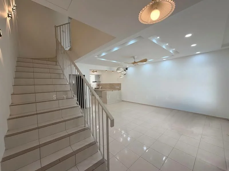 Living features: white painted walls, polished tile flooring, tray ceiling with recessed downlights, 5-blade ceiling fan, large open space, staircase with white railing, kitchen area visible in background, natural light from windows; style: modern.