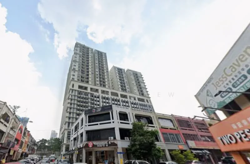 Exterior type: high-rise condominium; features: glass curtain wall, projecting balconies, multiple storeys, commercial units at ground level, surrounded by urban landscape, street view with shops, signage visible on facade; style: modern.