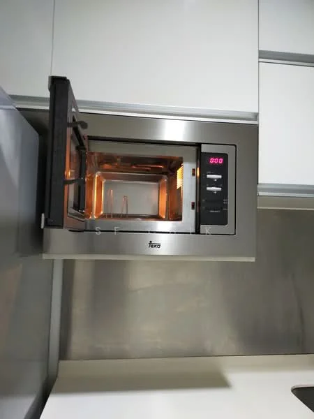 Kitchen features: built-in microwave, stainless-steel finish, digital display, interior light, microwave door with handle, mounted at eye level, surrounding cabinetry in light color, countertop surface; style: modern.