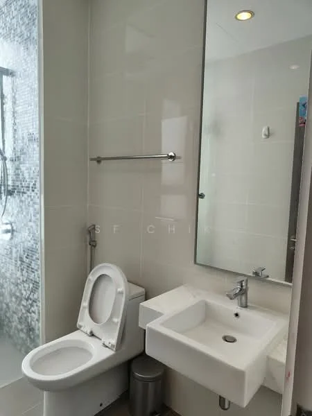 Bathroom features: white tiled walls, grey tile flooring, single-sink vanity with wall-mounted faucet, framed mirror, one-piece toilet, shower area with glass enclosure, chrome shower head, towel rail, waste bin; style: modern.