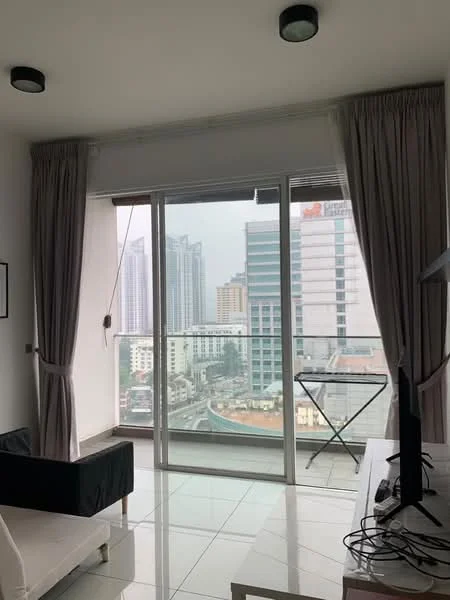 Living features: floor-to-ceiling windows, grey curtains, white walls, white tiled flooring, black sofa, TV console, wall-mounted TV, city skyline view, small ironing board, recessed ceiling lights; style: modern; view: city.