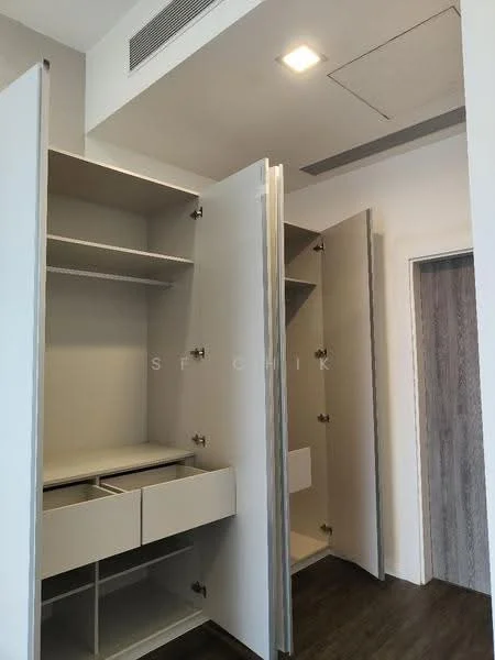 Room features: built-in wardrobe with open shelving, drawers in wardrobe, light-colored cabinetry, laminate flooring, recessed ceiling lights, neutral wall color, doorway leading to another room; style: modern.