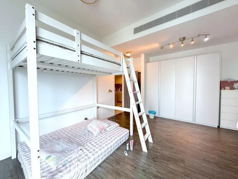Bedroom features: lofted bed frame with ladder, single bed with checkered bedding, white built-in wardrobe, laminate flooring, recessed ceiling lights, white walls, window with natural light, decorative wall art; style: modern.