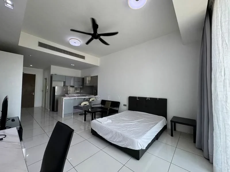 Room features: white painted walls, white ceiling, 5-blade ceiling fan, large window with sheer curtains, tile flooring, queen-size bed with no bedding, black upholstered bed frame, black bedside table, kitchenette with grey cabinets, stainless-steel sink, built-in stove, microwave, refrigerator, dining table with two chairs; style: modern.