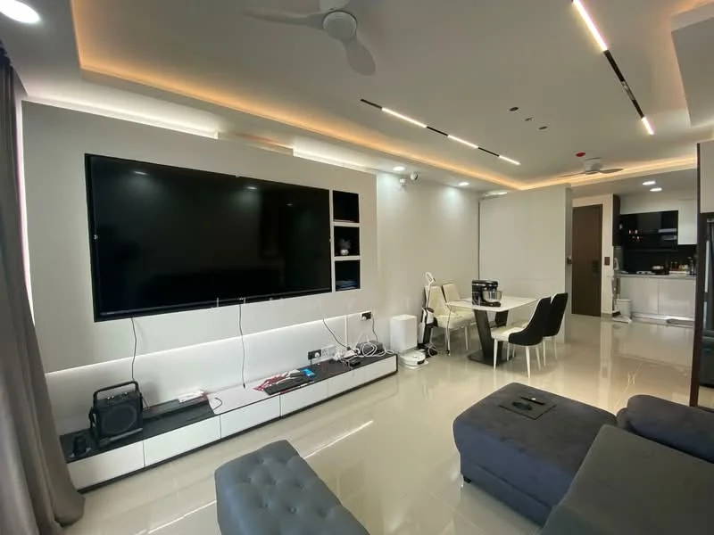 Living features: grey sectional sofa, white TV console, large wall-mounted TV, recessed LED downlights, ceiling fan, cream painted walls, glossy tile flooring, black coffee table, decorative wall paneling, open-plan layout to dining area; style: modern. Dining features: 4-seater dining table, black dining chairs, white cabinetry, open kitchen layout; style: modern.