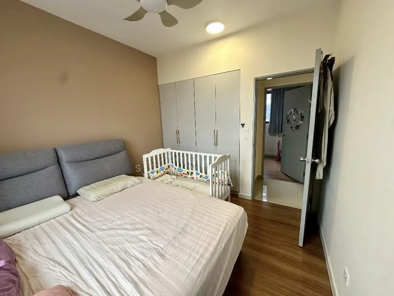 Bedroom features: king-size bed with grey upholstered headboard, white bedding, wooden flooring, light brown painted walls, built-in wardrobe with sliding doors, ceiling fan, natural light from window, baby crib, decorative wall clock; style: modern.