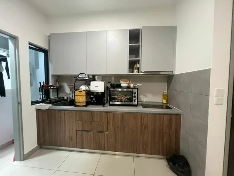 Kitchen features: grey upper cabinets, wooden lower cabinets, black countertop, stainless-steel sink, chrome pull-down faucet, built-in oven, toaster, coffee machine, microwave, kitchen utensils on countertop, tile backsplash, white walls, white tiled flooring; style: modern.
