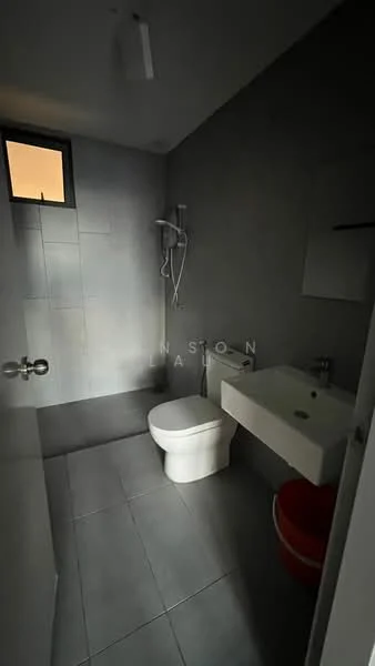 Bathroom features: grey tiled walls, grey tiled flooring, one-piece toilet, wall-mounted sink, chrome basin mixer faucet, shower with handheld shower head, mirror above sink, window for natural light; style: modern.