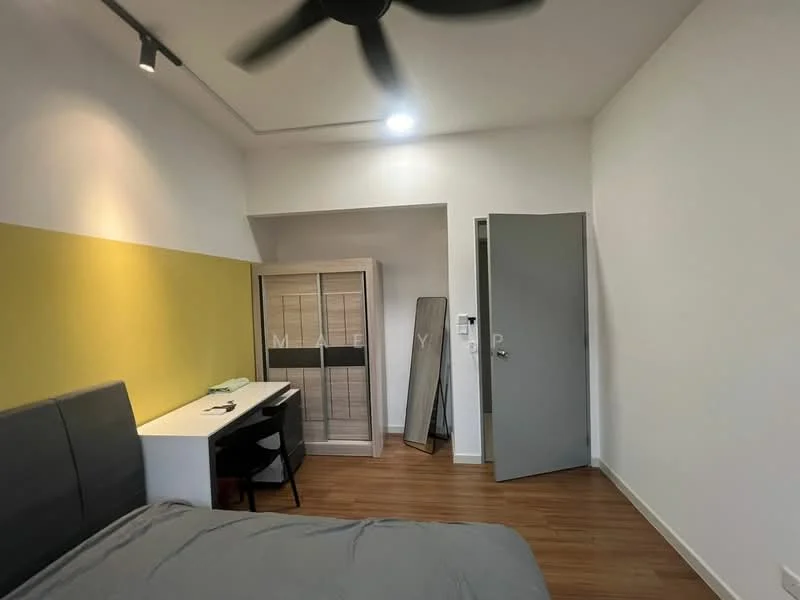 Bedroom features: grey upholstered bed, yellow accent wall, white painted walls, wooden flooring, ceiling fan, desk with chair, built-in wardrobe with sliding doors, door to hallway; style: modern.