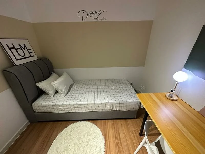 Bedroom features: single bed with grey upholstered headboard, white bedding, wooden desk, white chair, table lamp with round base, area rug with circular shape, decorative wall art with text, wooden flooring, two-tone painted walls; style: modern.