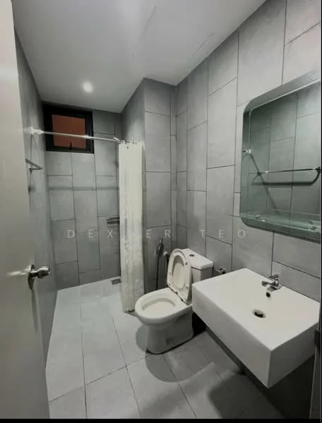 Bathroom features: grey tiled walls, grey tiled flooring, walk-in shower with glass partition, white wall-mounted sink, chrome basin mixer faucet, one-piece toilet, shower curtain, mirror above sink, window for natural light; style: modern.