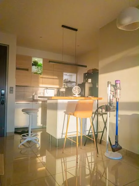 Kitchen features: white cabinetry, wooden countertop, island with seating, bar stools, stainless-steel sink, chrome faucet, built-in oven, microwave, refrigerator, pendant lighting, tile flooring, greenery on shelf, open shelving, wall-mounted vacuum cleaner; style: modern.