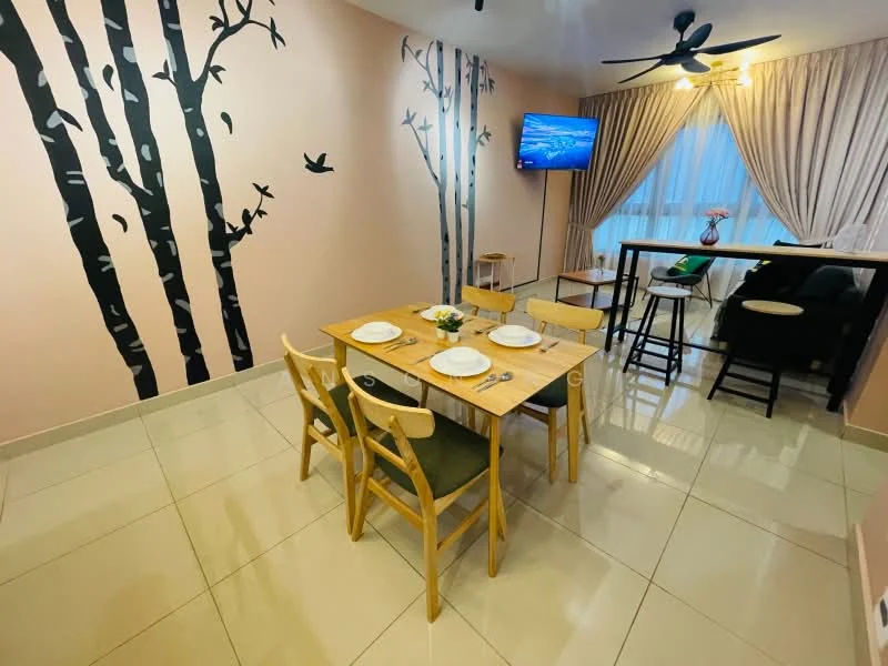 Dining features: dining table with 4 chairs, light wood table, green upholstered chairs, cream tiled flooring, pink painted walls, wall mural with trees and birds, floor-to-ceiling window with sheer curtains, wall-mounted TV, ceiling fan with light; style: modern. Living features: black sofa, side table, decorative plant, TV console; style: modern.