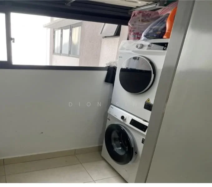 Laundry features: stacked washer and dryer, white appliances, tiled flooring, window with natural light, grey walls, shelf with laundry supplies, corner layout.