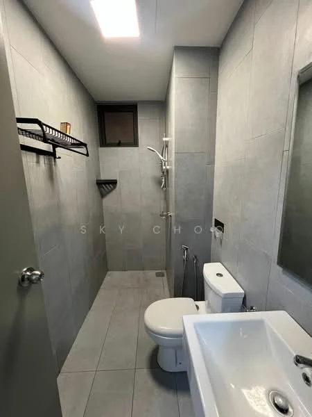 Bathroom features: grey tiled walls, grey tiled flooring, walk-in shower with glass partition, chrome handheld shower, wall-mounted shower head, toilet with dual flush, single-sink vanity with white cabinet, mirror above sink, towel rack, window for natural light; style: modern.