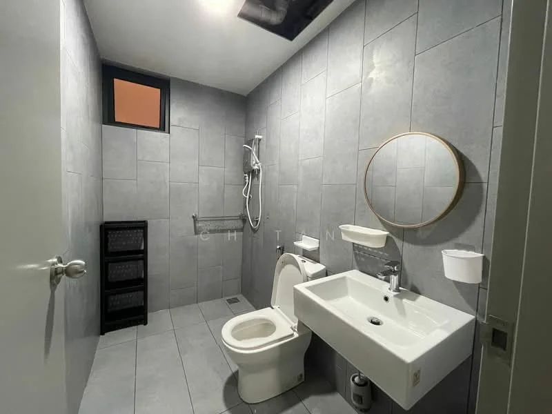 Bathroom features: grey ceramic tile flooring, grey tiled walls, walk-in shower with handheld shower, wall-mounted faucet, single-sink vanity with wall-mounted cabinet, round mirror, one-piece toilet, towel rail, storage rack, window for natural light; style: modern.