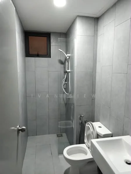 Bathroom features: grey ceramic tile flooring, grey wall tiles, walk-in shower with glass enclosure, rain shower head, handheld shower, chrome basin mixer faucet, single-sink vanity with white cabinet, one-piece toilet, window for natural light, recessed ceiling lights; style: modern.