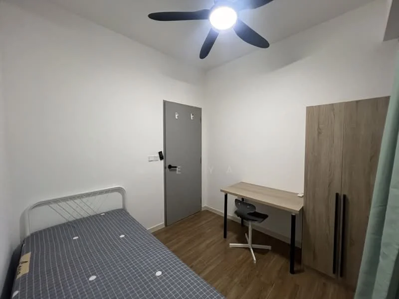Bedroom features: single bed with grey bedding, wooden study desk, black office chair, light wood wardrobe, white painted walls, wooden flooring, ceiling fan with light, door with grey finish; style: modern.