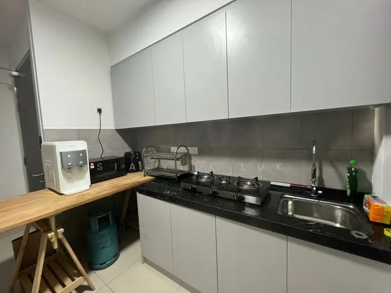 Kitchen features: grey flat-panel cabinets, black granite countertop, stainless-steel sink, chrome pull-down faucet, two-burner gas hob, wooden countertop on trestle legs, water dispenser, green plastic bottle, kitchen utensils on countertop, grey tiled backsplash, floor tiles, gas cylinder; style: modern.