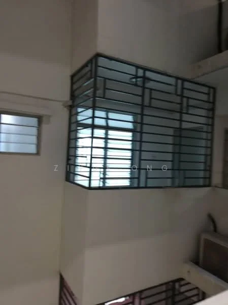 Room features: metal grille window, glass window, white painted walls, exposed ceiling, wooden beams, light fixture, flooring not visible.