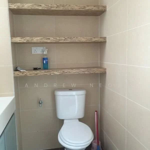 Bathroom features: white toilet, floating wooden shelves, cream tiled walls, dark tiled flooring, sink with cabinet, toilet paper holder, cleaning supplies, wall-mounted faucet; style: modern.