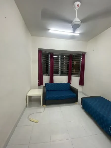 Living features: white painted walls, tile flooring, 5-blade ceiling fan with light, sofa in blue upholstery, white side table, single bed with blue bedding, curtains in burgundy, window with horizontal slats.