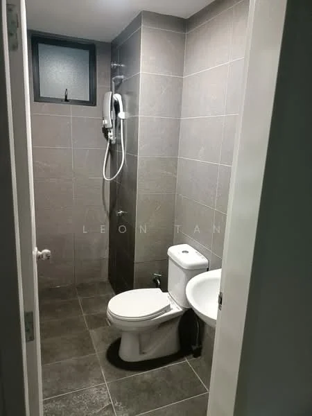 Bathroom features: grey tiled walls, grey tiled flooring, walk-in shower with glass partition, chrome handheld shower, toilet, sink, small window, wall-mounted faucet; style: modern.