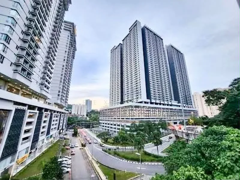 Exterior type: high-rise condominium; features: glass curtain wall, white painted facade, black accent panels, multiple balconies, surrounding greenery, landscaped grounds, driveway with interlocking pavers, urban context with nearby buildings, approximately 20-storey high-rise, parking deck visible, street access, manicured lawn; style: modern.