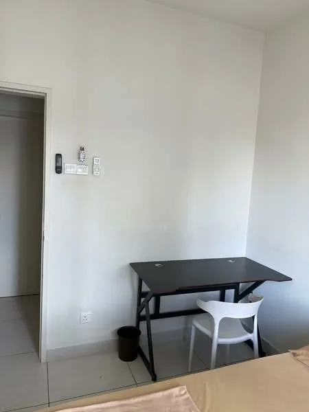 Room features: white painted walls, tile flooring, small black table, white plastic chair, doorway leading to another room, light switch, power outlet, waste bin; style: minimalist.