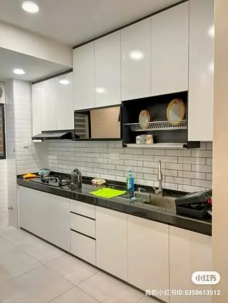 Kitchen features: white flat-panel cabinets, black granite countertop, white subway tile backsplash, stainless-steel sink, chrome pull-down faucet, built-in oven, freestanding range oven, dishwasher, recessed LED downlights, open shelving, kitchen utensils on countertop, wall-mounted storage rack; style: modern.