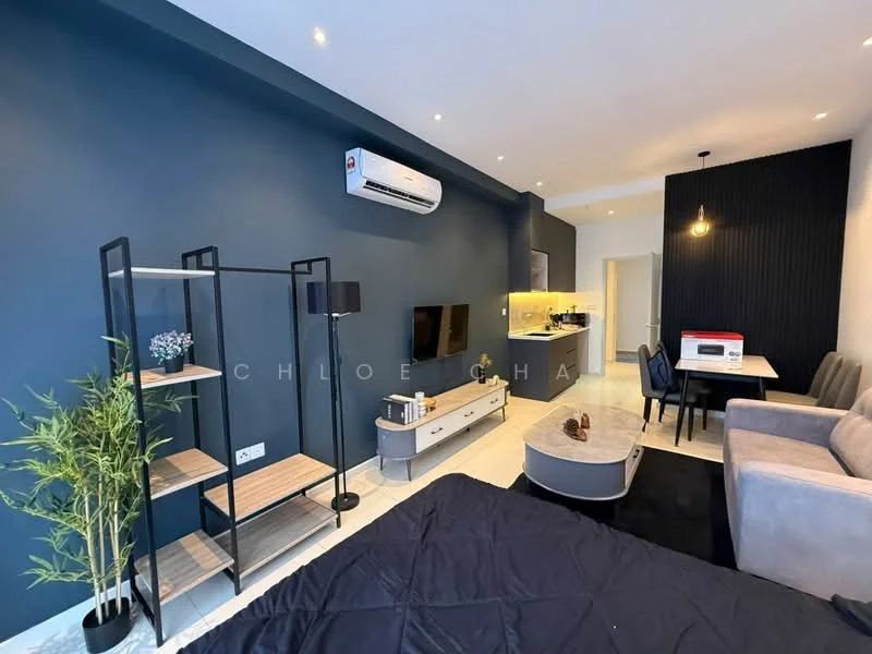 Living features: grey fabric sofa, coffee table, TV console, wall-mounted TV, open shelving unit, air conditioning unit, pendant light, recessed downlights, black accent wall, white walls, dining table with chairs, kitchenette with countertop, microwave, decorative plant; style: modern.