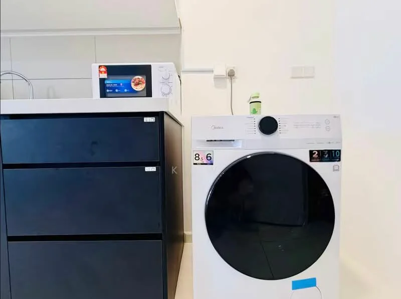 Laundry features: front-load washing machine in white, black cabinetry, microwave oven, countertop, wall-mounted electrical outlet, neutral tile flooring, minimalist design; style: modern.