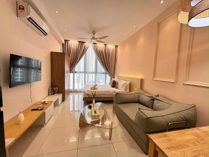 Living features: 3-seater fabric sofa in grey, glass coffee table, wall-mounted TV, wooden TV console, floor-to-ceiling windows, sheer curtains, recessed downlights, 5-blade ceiling fan with light, cream painted walls, glossy tile flooring, decorative wall paneling, bed with white bedding, wooden door, decorative vase on table; style: modern; view: city.
